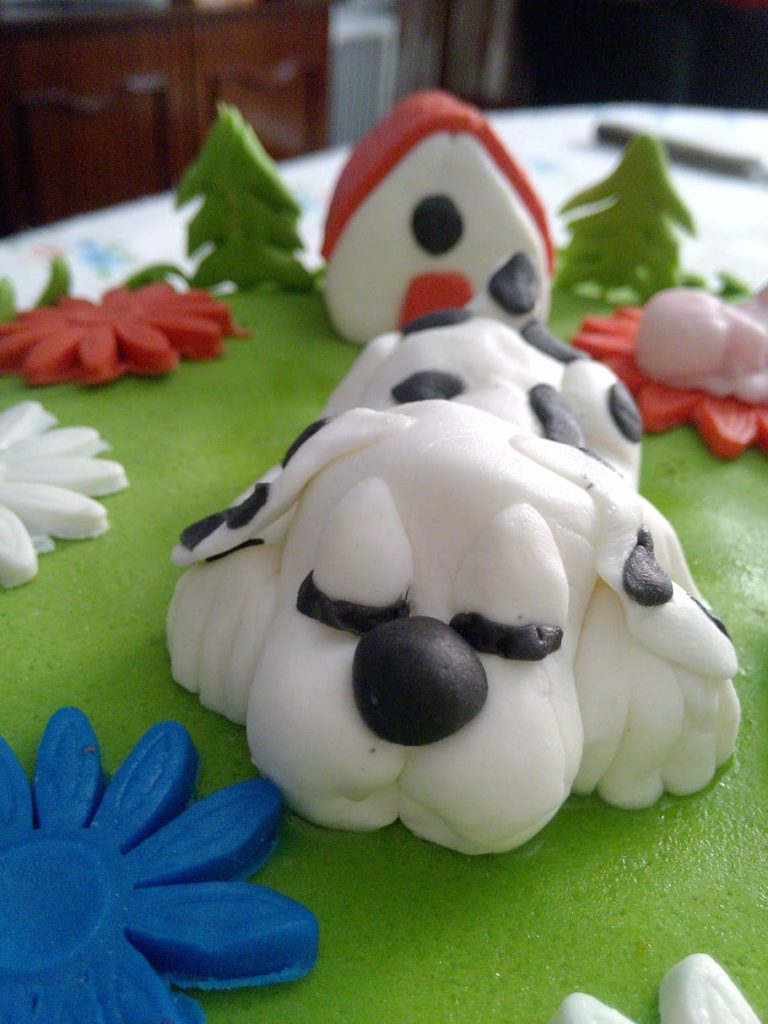 White with black spot Dog shaped birthday cake 